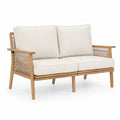 Dwuosobowa sofa z drewna teak z beżowymi poduszkami